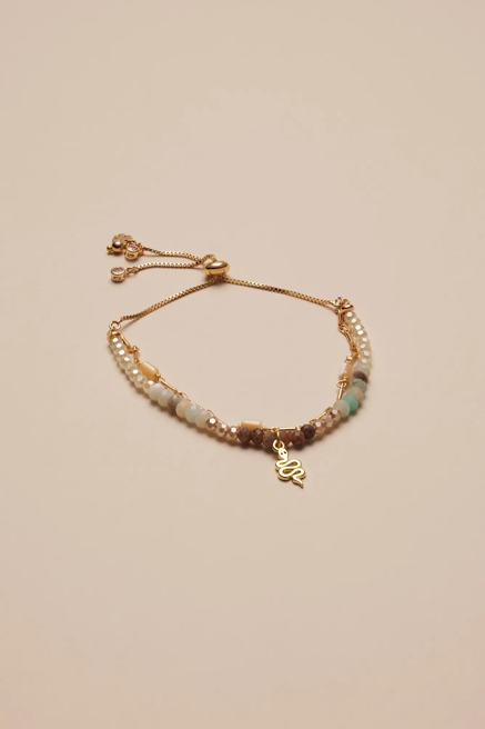 NEUTRAL STONE AND BEADED BRACELET W/ PENDANTS, image 1